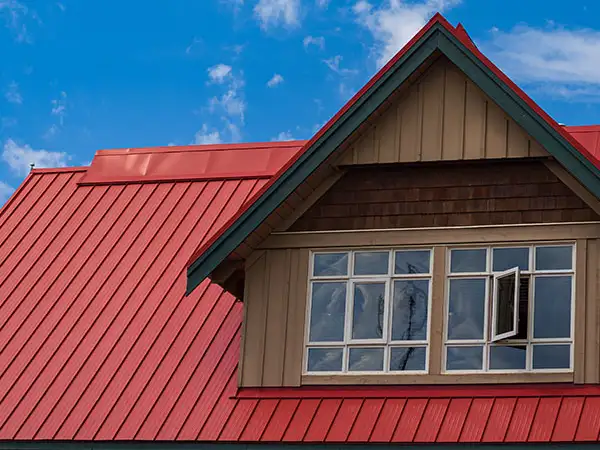 Home with a red metal roof